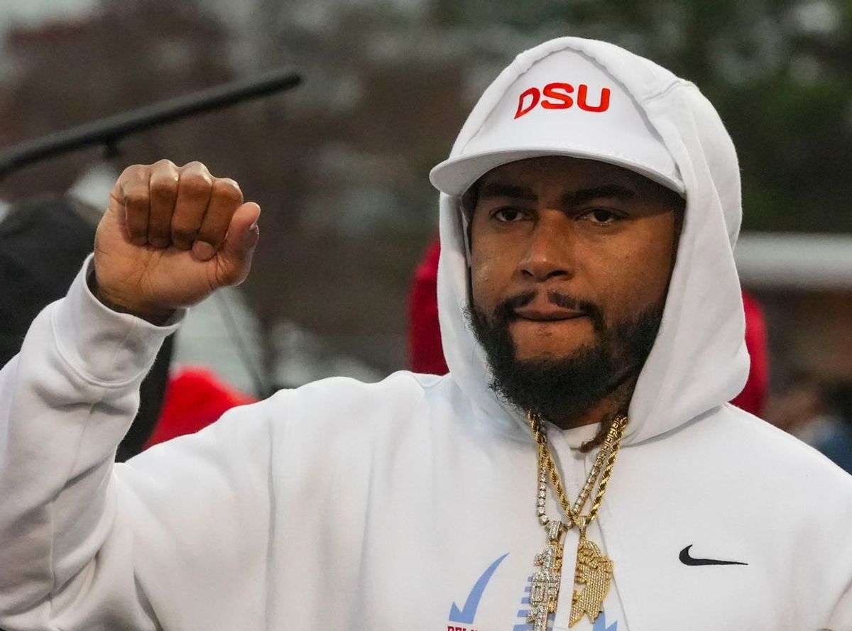Delaware State head coach DeSean Jackson stands with his team as the Approaching Storm plays at the conclusion of the Hornets’ 28-17 loss to South Carolina State at Alumni Stadium, Nov. 22, 2025.