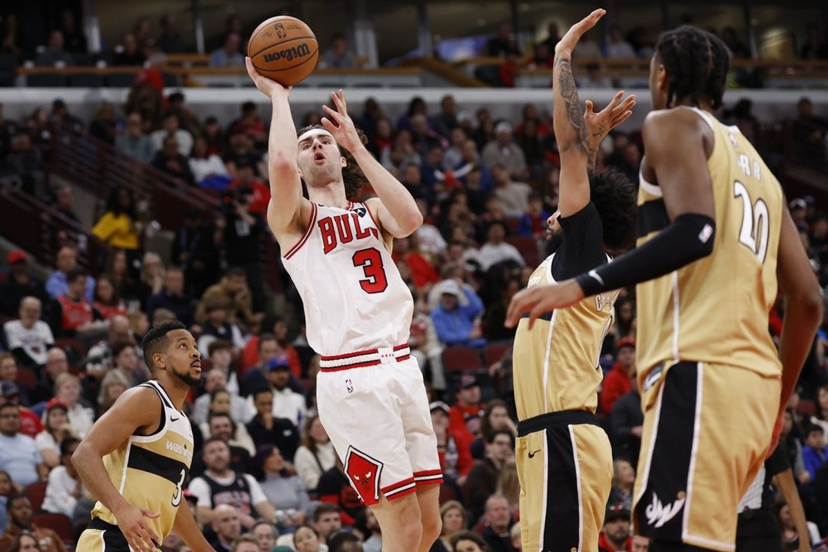 Nov 22, 2025; Chicago, Illinois, USA; Chicago Bulls guard Josh Giddey (3) shoots against the Washington Wizards during the first half at United Center. Mandatory Credit: Kamil Krzaczynski-Imagn Images