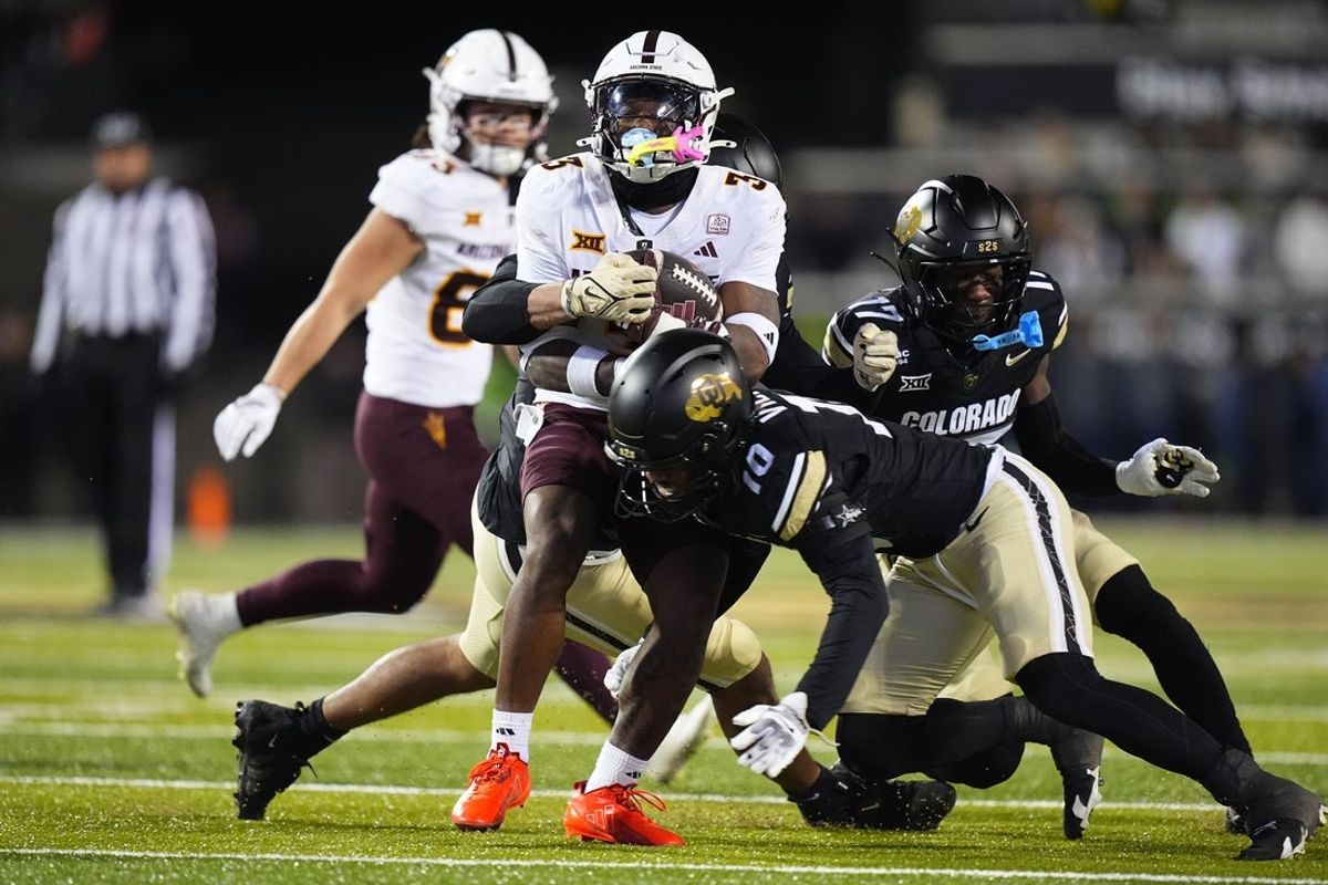 Nov 22, 2025; Boulder, Colorado, USA; Colorado Buffaloes defensive back Makari Vickers (10) tackles Arizona State Sun Devils running back Raleek Brown (3) in the first quarter at Folsom Field. Mandatory Credit: Ron Chenoy-Imagn Images