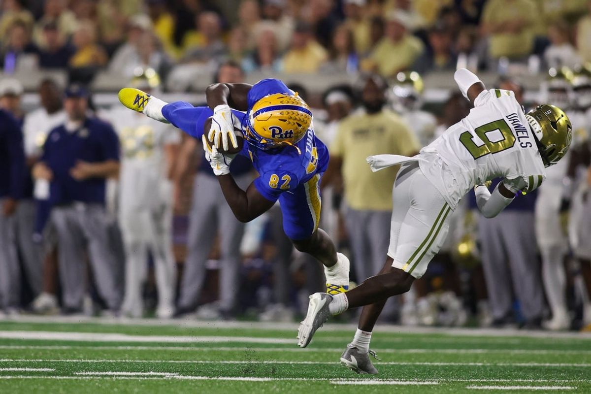 Nov 22, 2025; Atlanta, Georgia, USA; Pittsburgh Panthers tight end Malachi Thomas (82) catches a pass in front of Georgia Tech Yellow Jackets defensive back Omar Daniels (9) in the second quarter at Bobby Dodd Stadium at Hyundai Field. Mandatory Credit: Brett Davis-Imagn Images