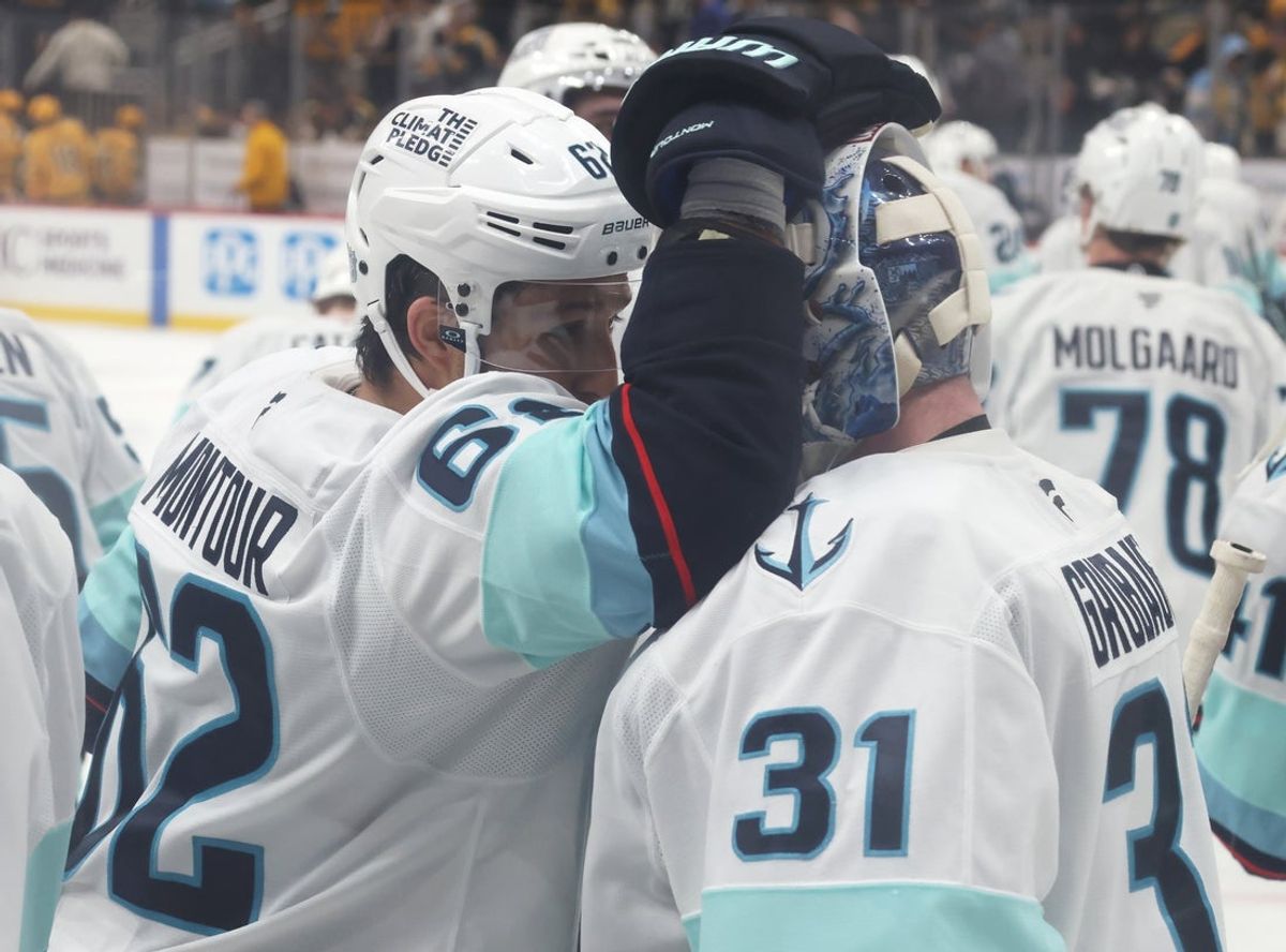 Nov 22, 2025; Pittsburgh, Pennsylvania, USA;  Seattle Kraken defenseman Brandon Montour (62) and goaltender Philipp Grubauer (31) celebrate after defeating the Pittsburgh Penguins in overtime at PPG Paints Arena. Mandatory Credit: Charles LeClaire-Imagn Images