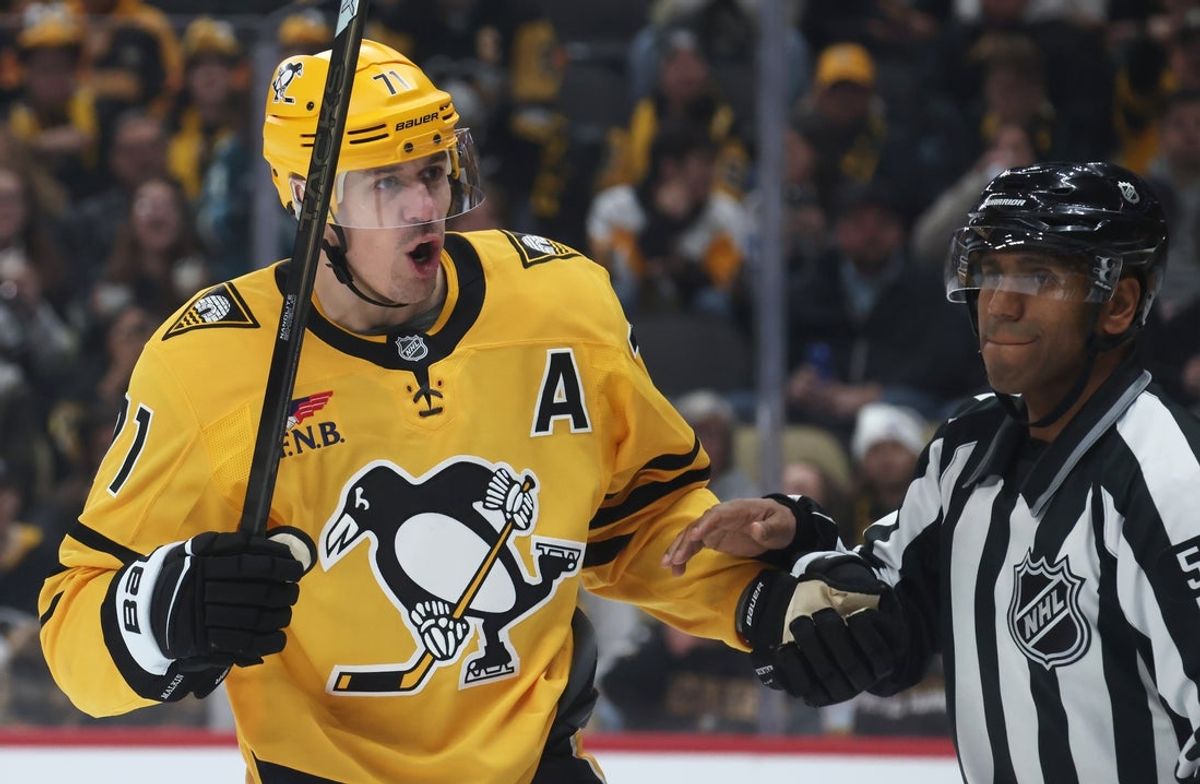 Nov 22, 2025; Pittsburgh, Pennsylvania, USA;  Pittsburgh Penguins center Evgeni Malkin (71) reacts to the Seattle Kraken as linesman Shandor Alphonso (52) restrains Malkin during the third period at PPG Paints Arena. Mandatory Credit: Charles LeClaire-Imagn Images