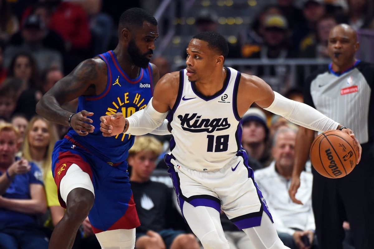 Nov 22, 2025; Denver, Colorado, USA; Sacramento Kings guard Russell Westbrook (18) handles the ball against Denver Nuggets guard Tim Hardaway Jr. (10) during the first half at Ball Arena. Mandatory Credit: Christopher Hanewinckel-Imagn Images