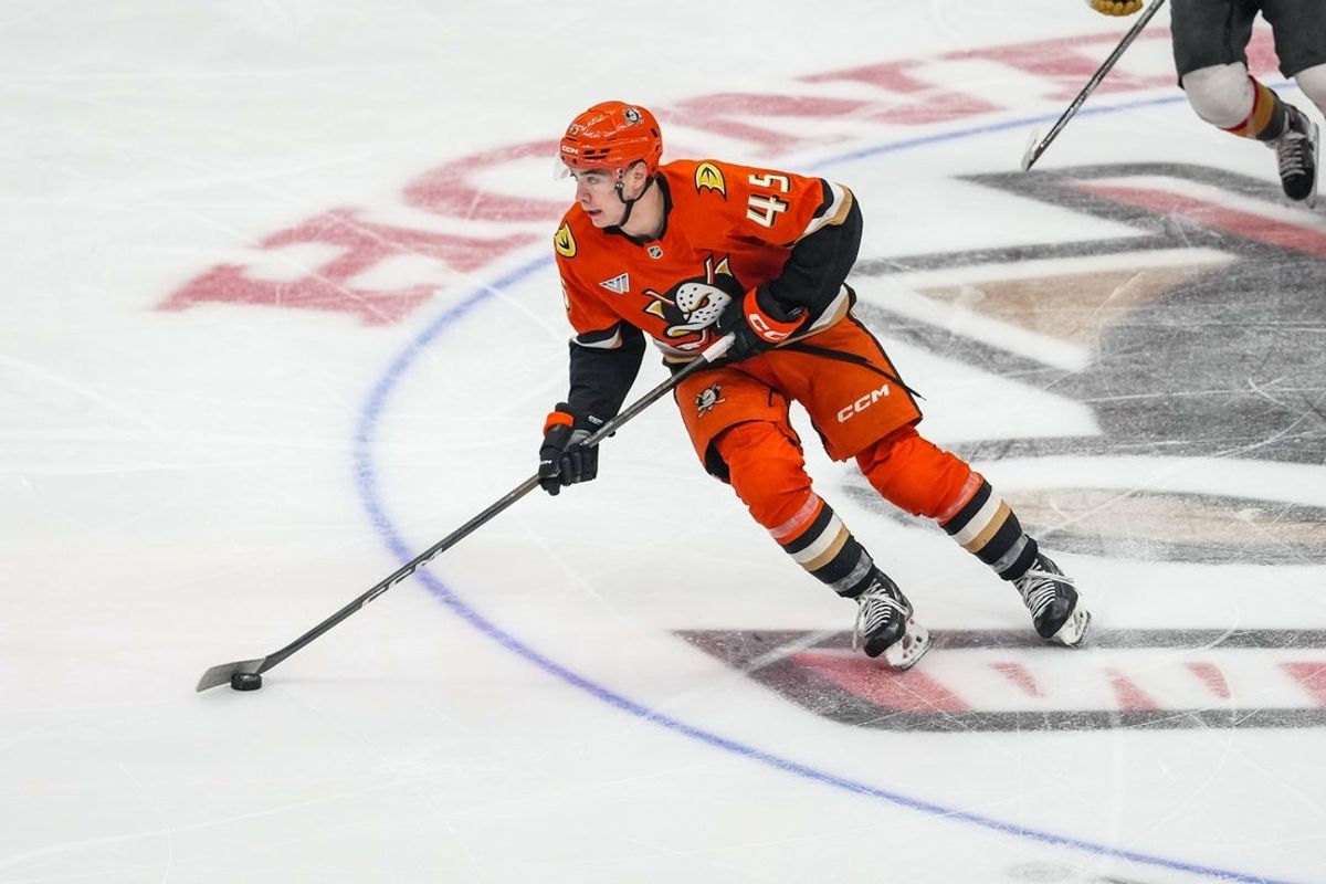 Nov 22, 2025; Anaheim, California, USA; Anaheim Ducks right wing Beckett Sennecke (45) skates with the puck in the game against the Vegas Golden Knights at Honda Center. Mandatory Credit: Corinne Votaw-Imagn Images