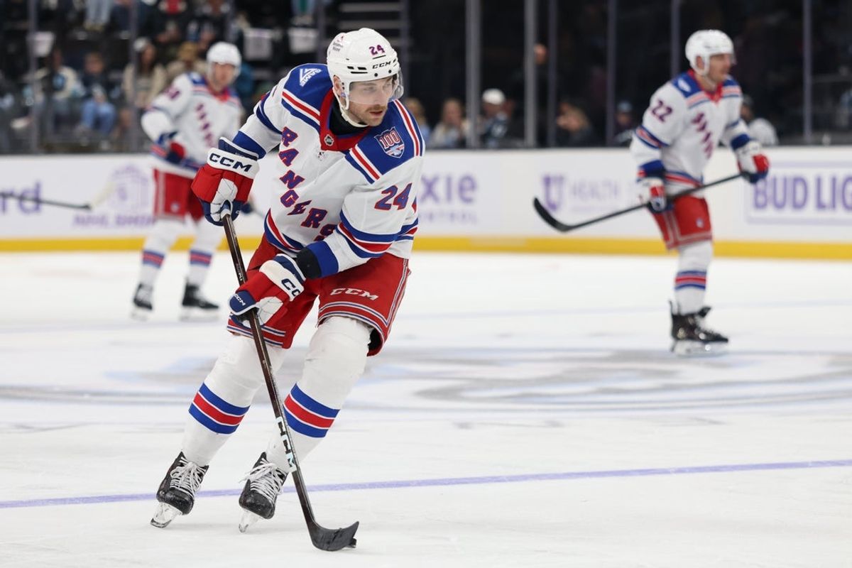 Nov 22, 2025; Salt Lake City, Utah, USA; New York Rangers defenseman Carson Soucy (24) moves the puck against the Utah Mammoth during the third period at Delta Center. Mandatory Credit: Rob Gray-Imagn Images