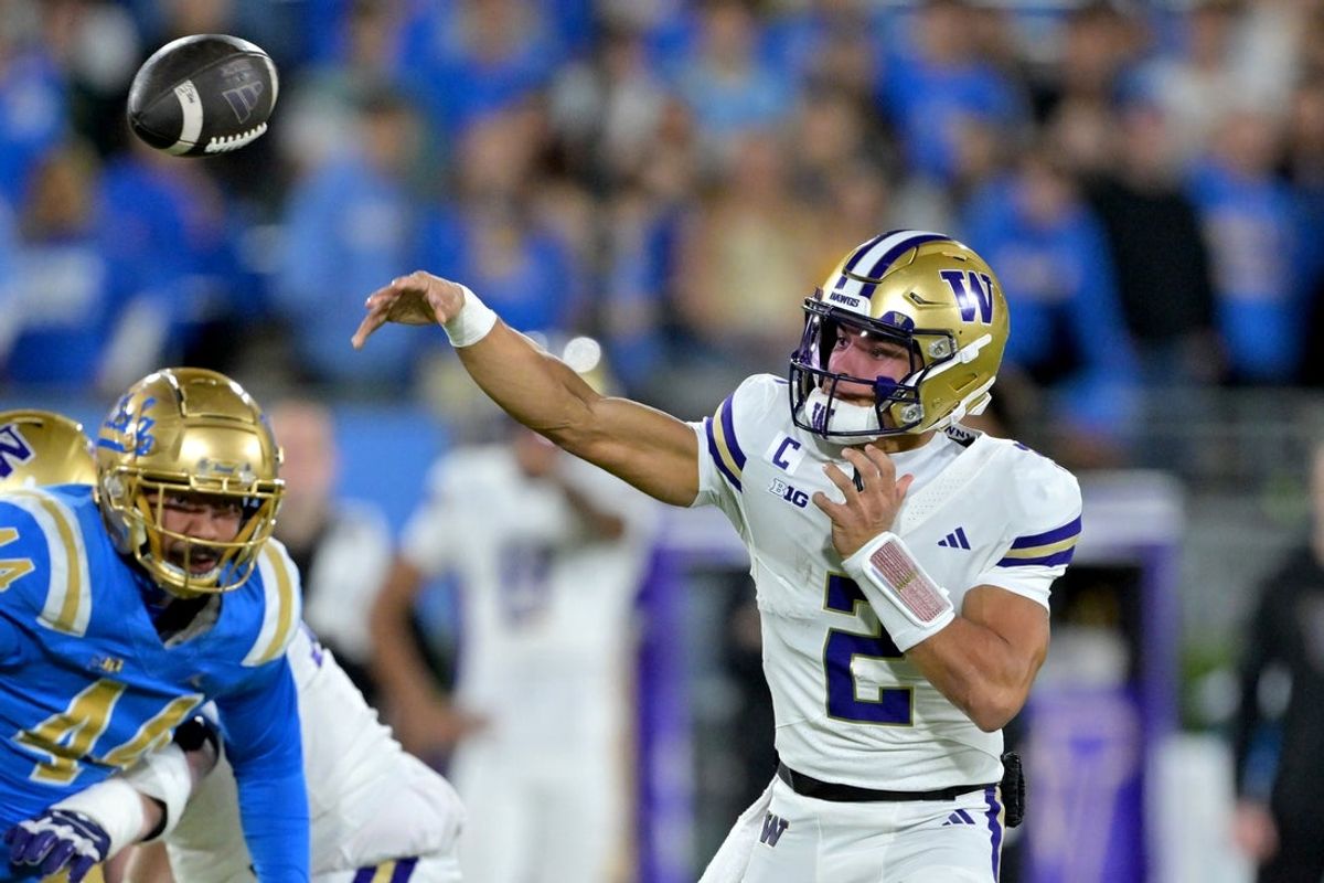 Nov 22, 2025; Pasadena, California, USA;  Washington Huskies quarterback Demond Williams Jr. (2) passes the ball during the first half against the UCLA Bruins at the Rose Bowl. Mandatory Credit: Jayne Kamin-Oncea-Imagn Images