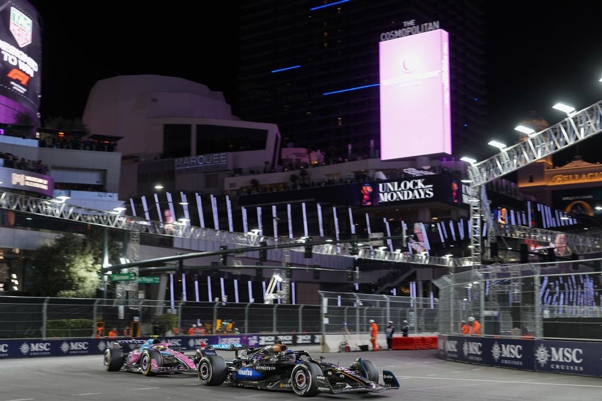 Nov 22, 2025; Las Vegas, NV, USA; Williams driver Alex Albon (23) drives ahead of Alpine driver Franco Colapinto (43) during the Las Vegas Grand Prix at the Las Vegas Strip Circuit. Mandatory Credit: Lucas Peltier-Imagn Images