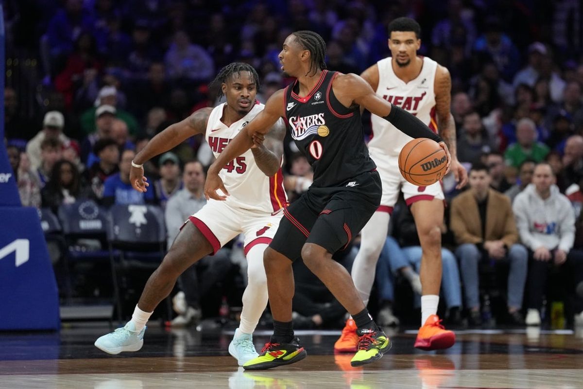 Nov 23, 2025; Philadelphia, Pennsylvania, USA; Philadelphia 76ers guard Tyrese Maxey (0) controls the ball against Miami Heat guard Davion Mitchell (45) in the first quarter at Xfinity Mobile Arena. Mandatory Credit: Kyle Ross-Imagn Images