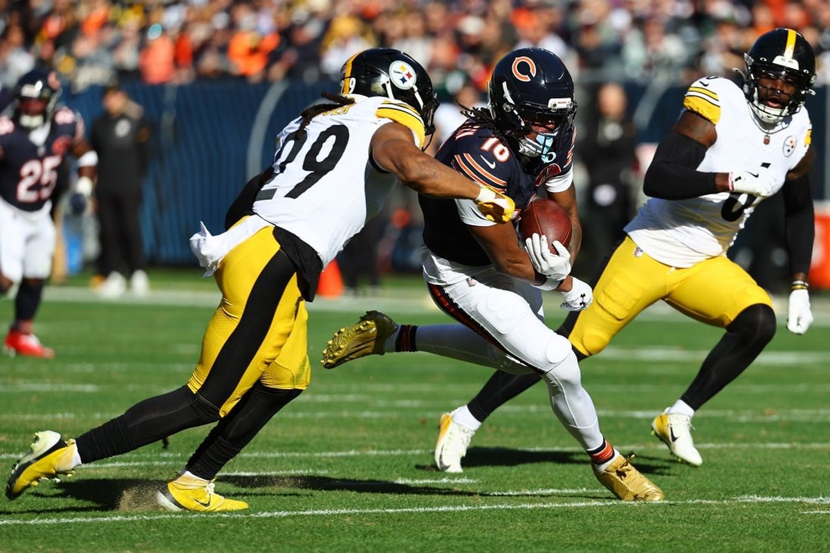 Nov 23, 2025; Chicago, Illinois, USA; Chicago Bears wide receiver Luther Burden III (10) makes a catch agsiasnt Pittsburgh Steelers safety Kyle Dugger (29) during the first half at Soldier Field. Mandatory Credit: Mike Dinovo-Imagn Images