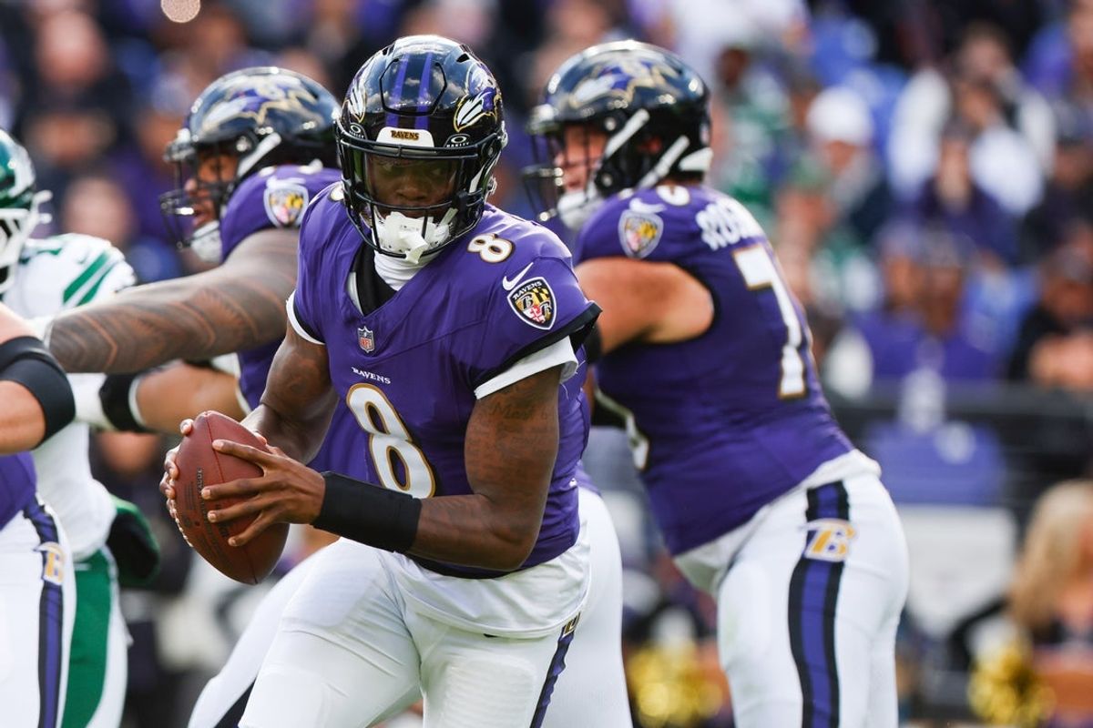 Nov 23, 2025; Baltimore, Maryland, USA; Baltimore Ravens quarterback Lamar Jackson (8) drops back for a handoff during the second quarter against the New York Jets at M&T Bank Stadium. Mandatory Credit: Peter Casey-Imagn Images