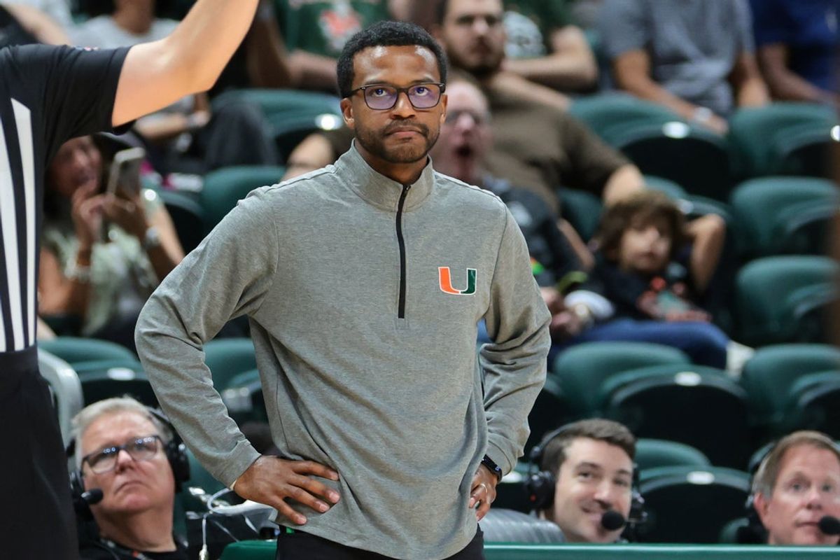 Nov 23, 2025; Coral Gables, Florida, USA; Miami Hurricanes head coach Jai Lucas watches from the sideline against the Delaware State Hornets during the second half at Watsco Center. Mandatory Credit: Sam Navarro-Imagn Images