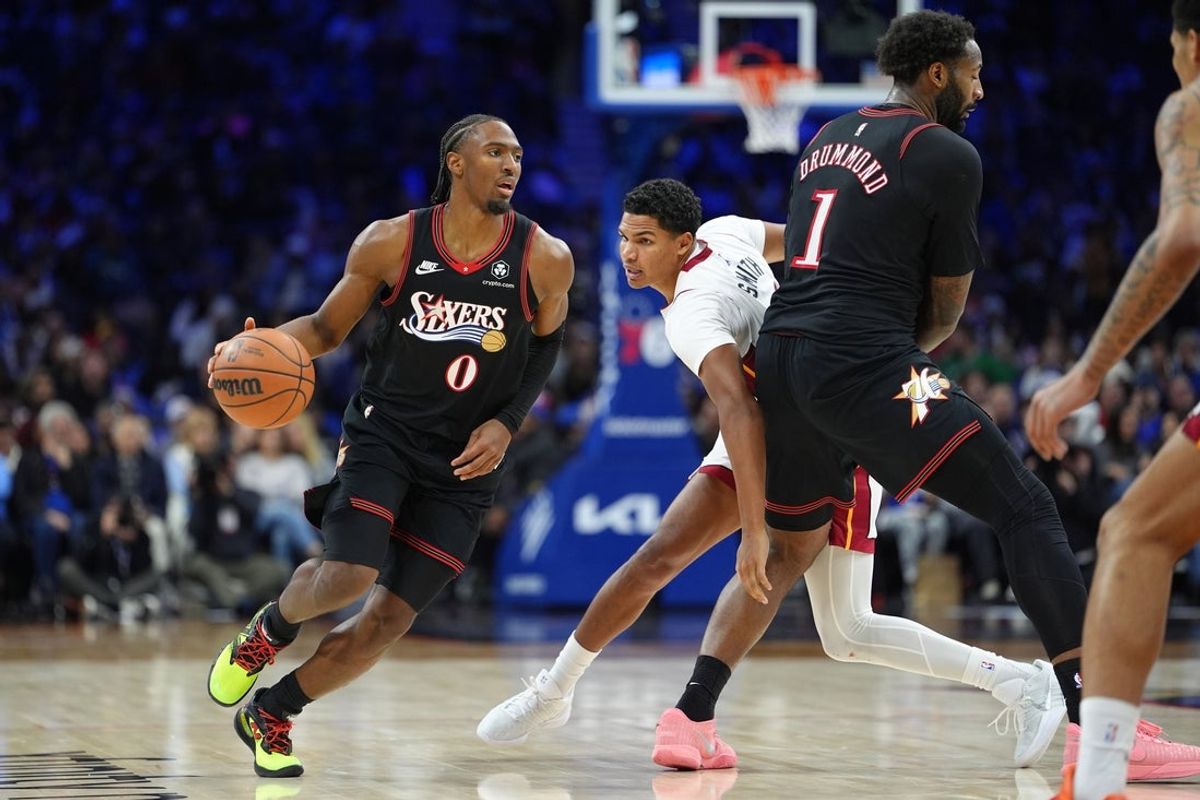 Nov 23, 2025; Philadelphia, Pennsylvania, USA; Philadelphia 76ers guard Tyrese Maxey (0) controls the ball as center Andre Dummond (1) picks Miami Heat guard Dru Smith (12) in the third quarter at Xfinity Mobile Arena. Mandatory Credit: Kyle Ross-Imagn Images