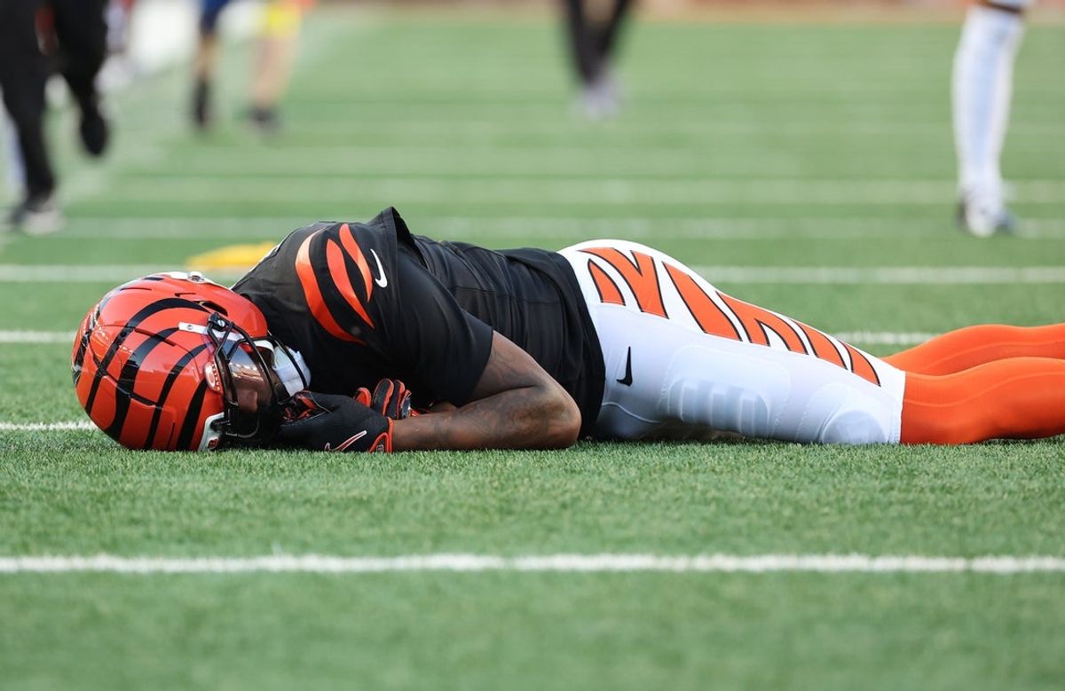 Nov 23, 2025; Cincinnati, Ohio, USA; Cincinnati Bengals wide receiver Tee Higgins (5) is injured on a play during the second half against the New England Patriots at Paycor Stadium. Mandatory Credit: Joseph Maiorana-Imagn Images