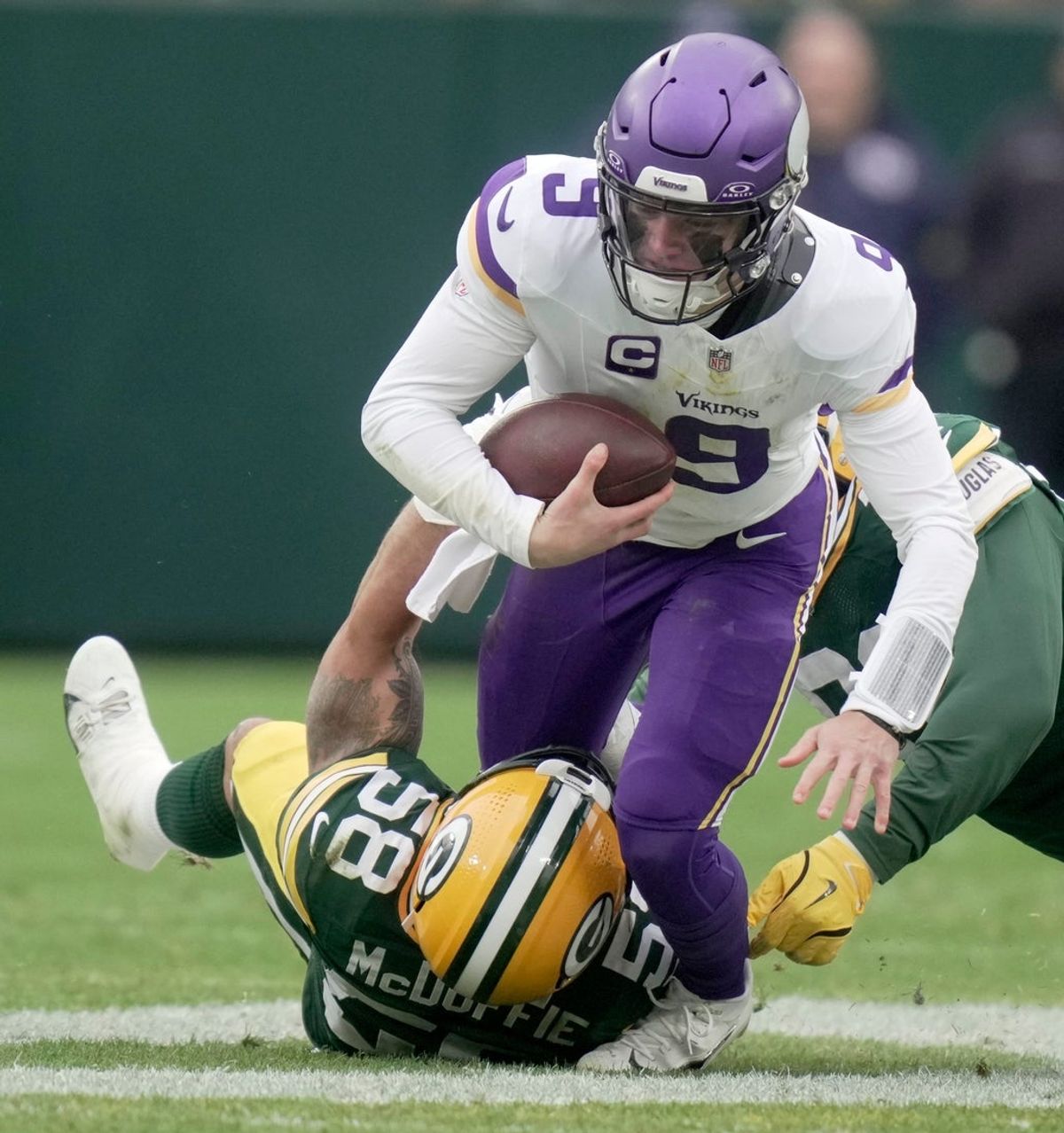 Green Bay Packers linebacker Isaiah McDuffie (58) sacks quarterback J.J. McCarthy (9) during the second quarter of their game Sunday, November 23, 2025 at Lambeau Field in Green Bay, Wisconsin.