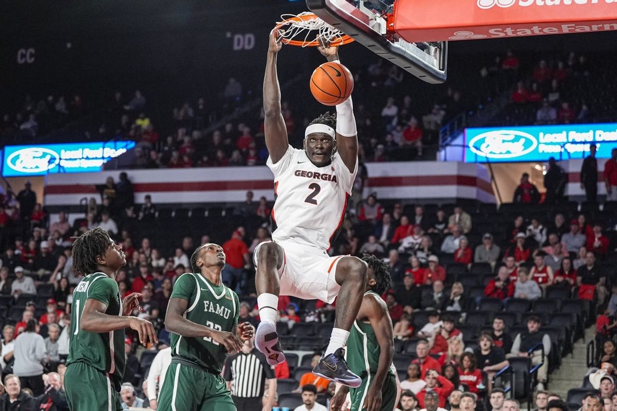 Nov 17, 2025; Athens, Georgia, USA; Georgia Bulldogs center Somto Cyril (2) dunks the ball against the Florida A&M Rattlers during the second half at Stegeman Coliseum. Mandatory Credit: Dale Zanine-Imagn Images