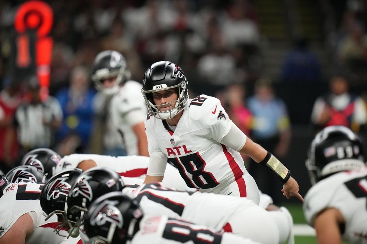 Nov 23, 2025; New Orleans, Louisiana, USA; Atlanta Falcons quarterback Kirk Cousins (18) at the line of scrimmage against the New Orleans Saints during the first half at Caesars Superdome. Mandatory Credit: Matthew Hinton-Imagn Images