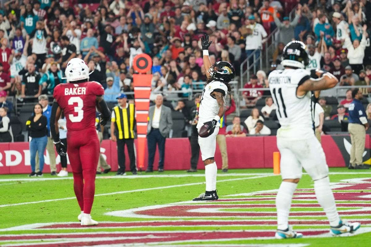 Nov 23, 2025; Glendale, Arizona, USA;  Jacksonville Jaguars wide receiver Jakobi Meyers (3) celebrates after scoring a touchdown during the third quarter against the Arizona Cardinals at State Farm Stadium. Mandatory Credit: Joe Camporeale-Imagn Images