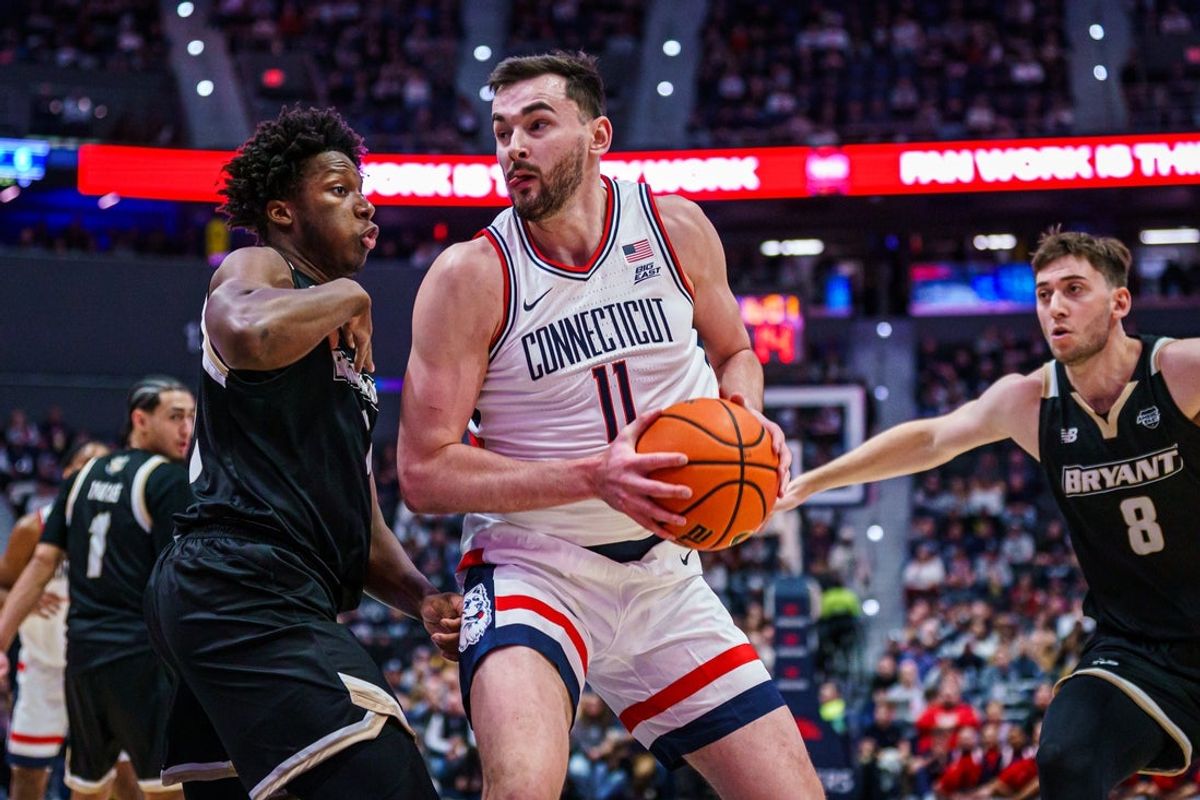 Nov 23, 2025; Hartford, Connecticut, USA; UConn Huskies forward Alex Karaban (11) drives the ball against the Bryant Bulldogs in the first half at Peoples Bank Arena. Mandatory Credit: David Butler II-Imagn Images