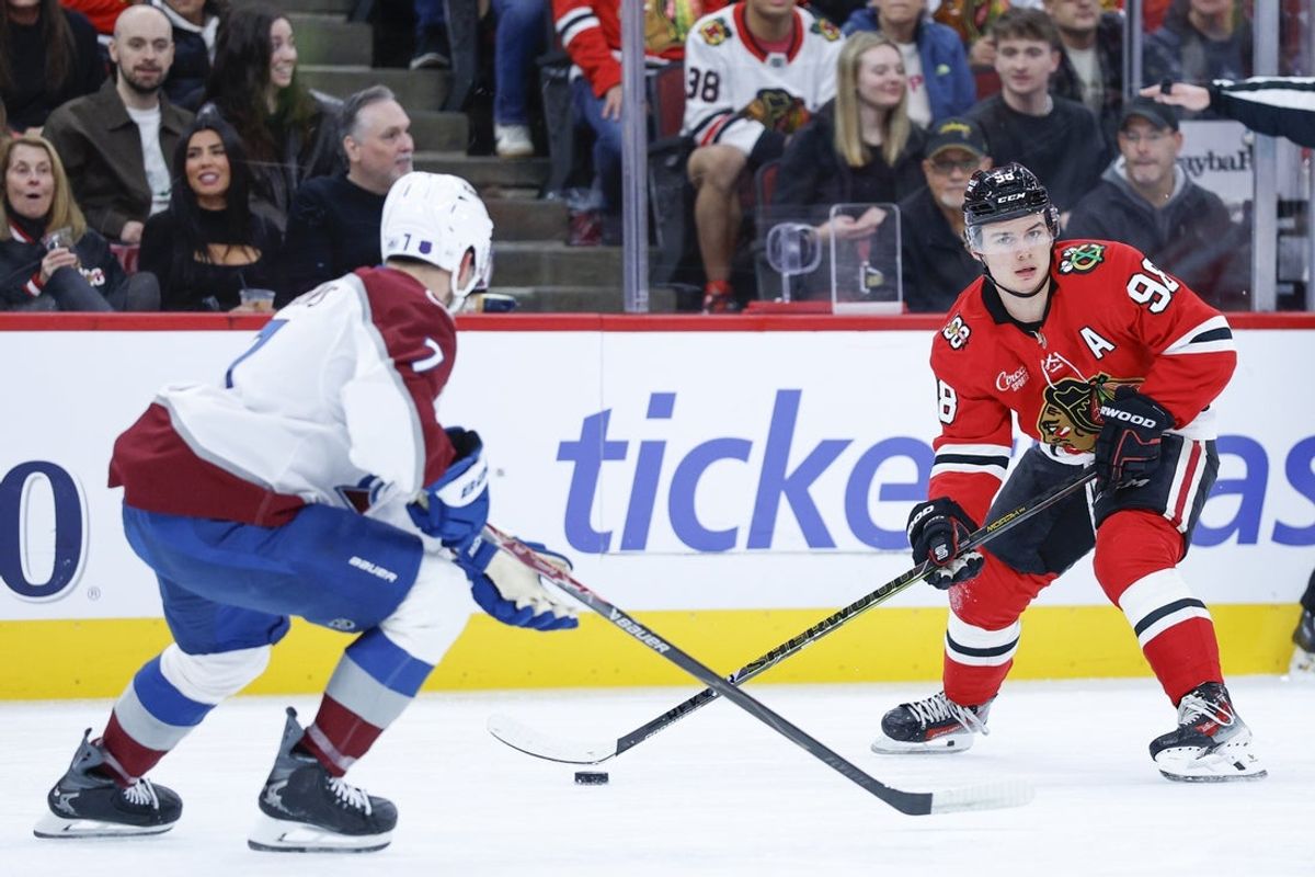 Nov 23, 2025; Chicago, Illinois, USA; Colorado Avalanche defenseman Devon Toews (7) defends against Chicago Blackhawks center Connor Bedard (98) during the first period at United Center. Mandatory Credit: Kamil Krzaczynski-Imagn Images