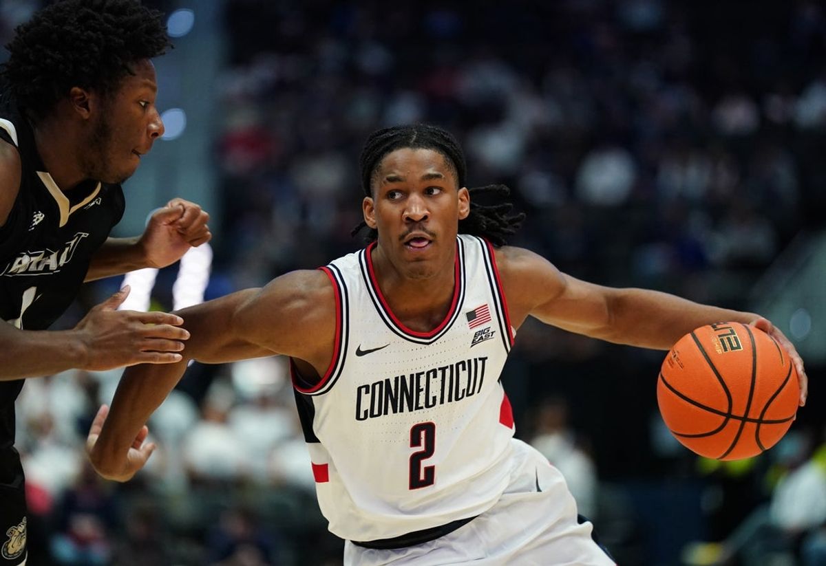 Nov 23, 2025; Hartford, Connecticut, USA; UConn Huskies guard Silas Demary Jr. (2) drives the ball against Bryant Bulldogs guard Jakai Robinson (13) in the second half at Peoples Bank Arena. Mandatory Credit: David Butler II-Imagn Images