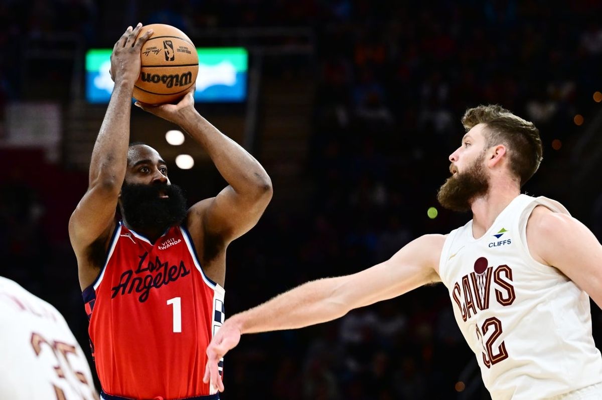 Nov 23, 2025; Cleveland, Ohio, USA; Los Angeles Clippers guard James Harden (1) shoots over the defense of  Cleveland Cavaliers forward Dean Wade (32) during the second half at Rocket Arena. Mandatory Credit: Ken Blaze-Imagn Images