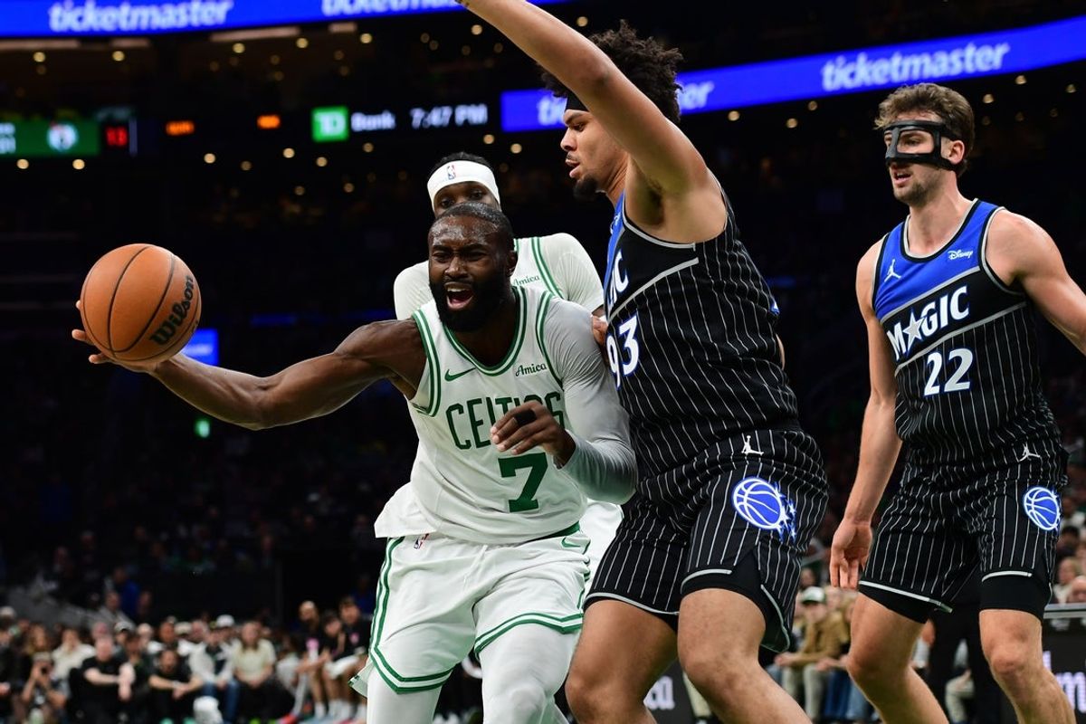 Nov 23, 2025; Boston, Massachusetts, USA; Orlando Magic forward Noah Penda (93) defends Boston Celtics guard Jaylen Brown (7) during the second half at TD Garden. Mandatory Credit: Bob DeChiara-Imagn Images