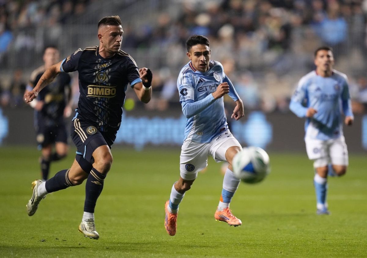Nov 23, 2025; Chester, Pennsylvania, USA; New York City FC forward Agustín Ojeda (26) and Philadelphia Union defender Kai Wagner (27) chase after the ball in the first half at Subaru Park. Mandatory Credit: James Lang-Imagn Images