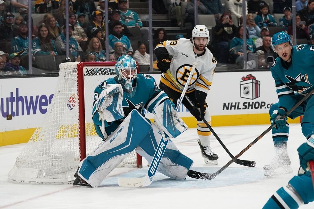 Nov 23, 2025; San Jose, California, USA;  San Jose Sharks goaltender Yaroslav Askarov (30) and San Jose Sharks defenseman Vincent Desharnais (5) defend the goal as Boston Bruins center Pavel Zacha (18) waits for a pass in the first period at SAP Center in San Jose. Mandatory Credit: David Gonzales-Imagn Images