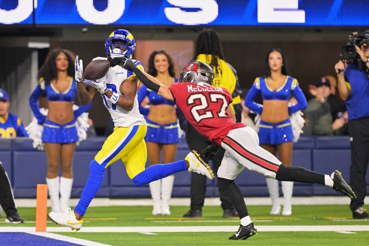 Nov 23, 2025; Inglewood, California, USA; Los Angeles Rams wide receiver Davante Adams (17) catches a twenty-four touchdown pass thrown by quarterback Matthew Stafford (not pictured) against Tampa Bay Buccaneers cornerback Zyon McCollum (27) during the second quarter at SoFi Stadium.  Mandatory Credit: Jayne Kamin-Oncea-Imagn Images
