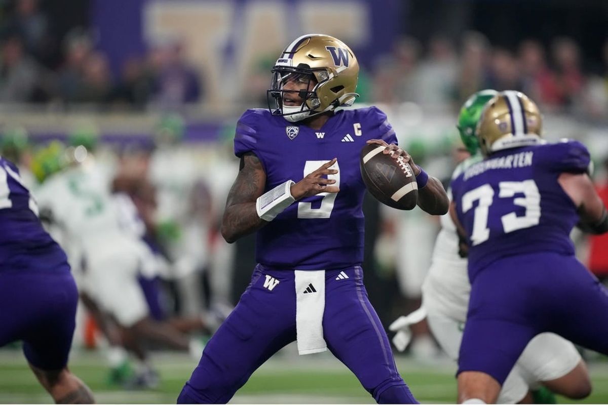 Dec 1, 2023; Las Vegas, NV, USA; Washington Huskies quarterback Michael Penix Jr. (9) throws the ball against the Oregon Ducks  in the first half at Allegiant Stadium.