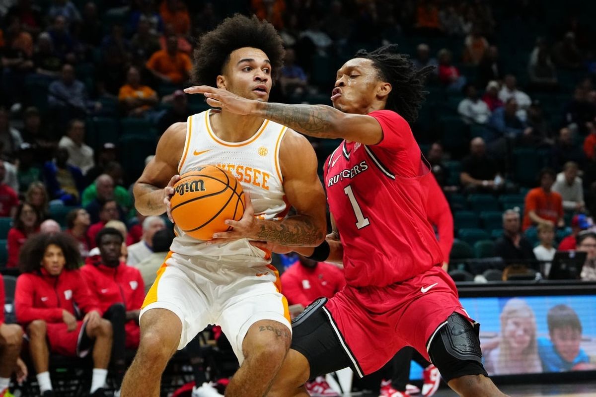 Nov 24, 2025; Las Vegas, NV, USA; Tennessee Volunteers guard Ja'Kobi Gillespie (0) is defended by Rutgers Scarlet Knights guard Jamichael Davis (1) during the first half in a 2025 Players Era Festival group play game at MGM Grand Garden Arena. Mandatory Credit: Stephen R. Sylvanie-Imagn Images