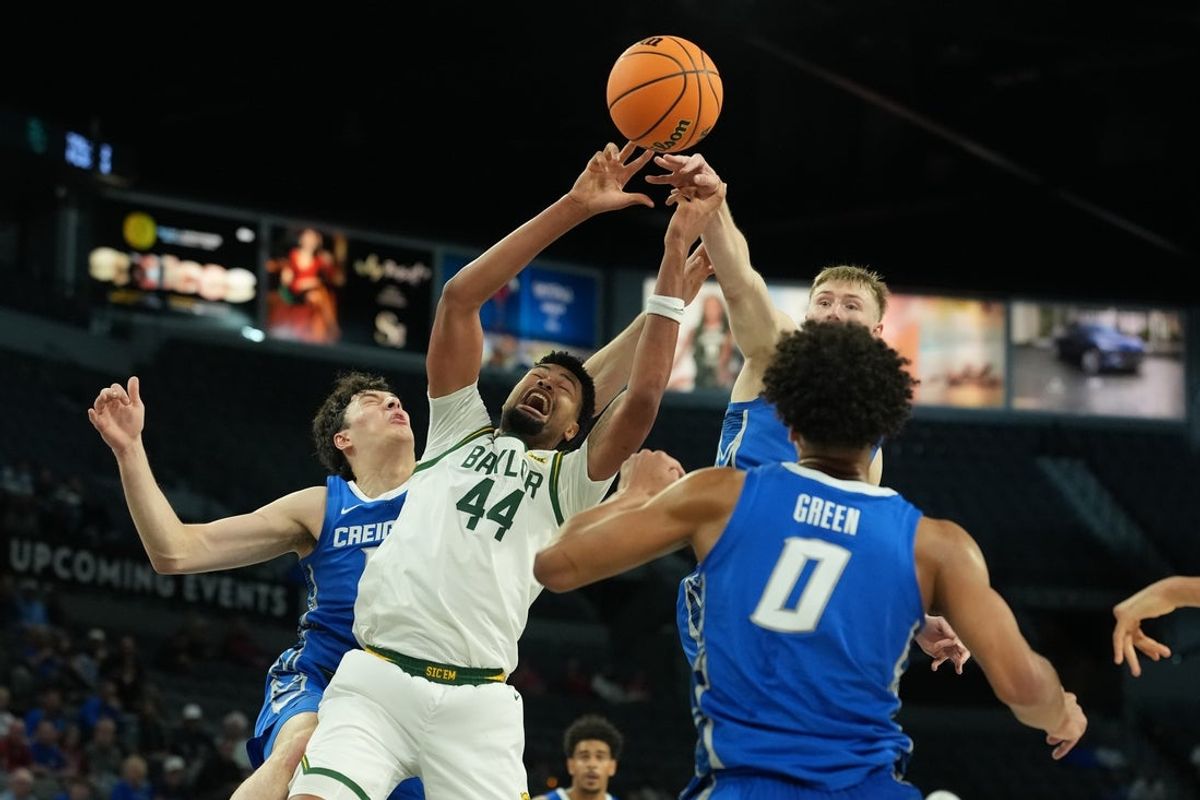 Nov 24, 2025; Las Vegas, Nevada, USA; Baylor Bears center Caden Powell (44) and Creighton Bluejays forward Kerem Konan (17) and guard Josh Dix (4) battle for the rebound during the first half in a 2025 Players Era Festival group play game at Michelob Ultra Arena. Mandatory Credit: Kirby Lee-Imagn Images