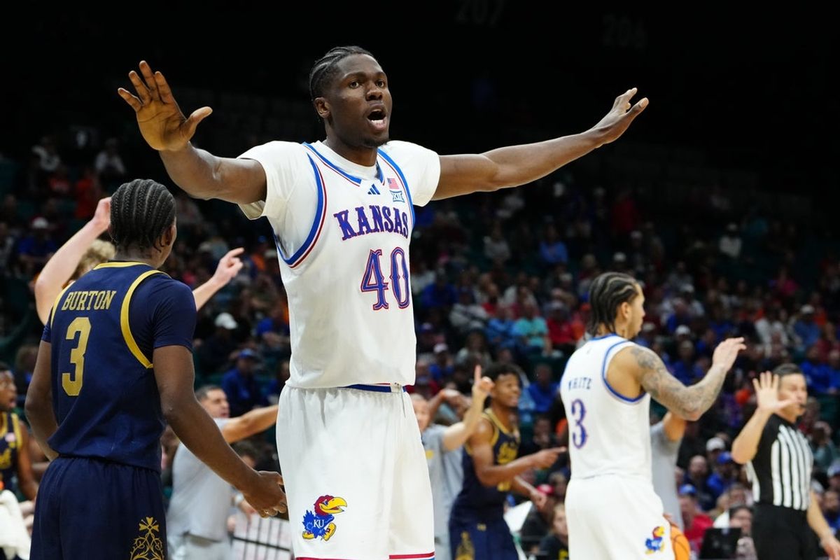 Nov 24, 2025; Las Vegas, Nevada, USA; Kansas Jayhawks forward Flory Bidunga (40) reacts on the court against the Notre Dame Fighting Irish during the second half in a 2025 Players Era Festival group play game at MGM Grand Garden Arena. Mandatory Credit: Stephen R. Sylvanie-Imagn Images