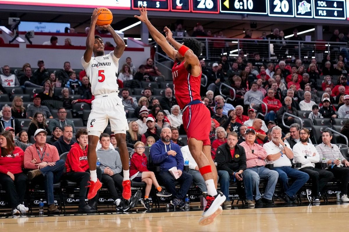 Cincinnati Bearcats guard Sencire Harris (5) shoots over NJIT Highlanders forward Jordan Rogers (3) in the first half of the NCAA men’s basketball game between the Cincinnati Bearcats and the NJIT Highlanders at Fifth Third Arena in Cincinnati on Monday, Nov. 24, 2025.
