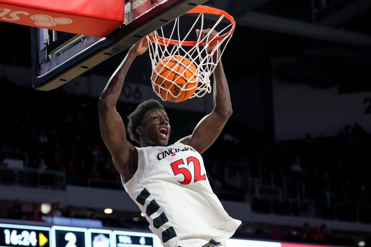 Cincinnati Bearcats center Moustapha Thiam (52) dunks in the first half of the NCAA men’s basketball game between the Cincinnati Bearcats and the NJIT Highlanders at Fifth Third Arena in Cincinnati on Monday, Nov. 24, 2025.