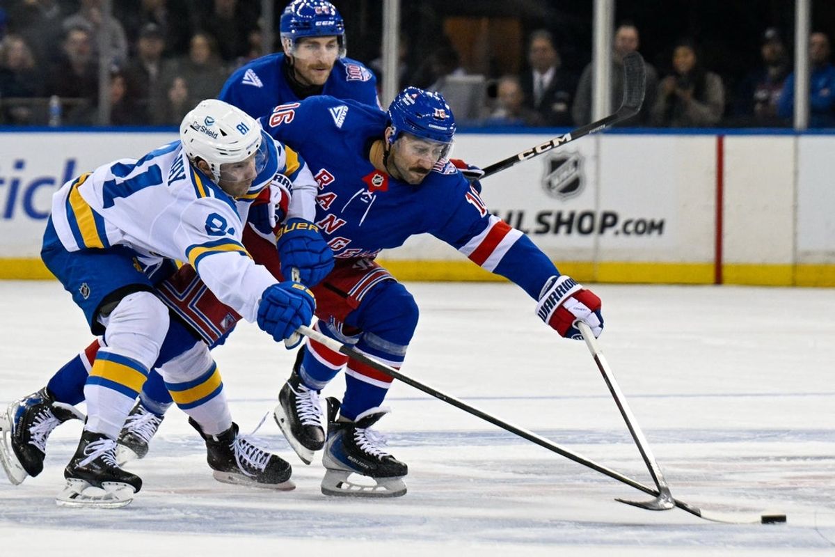 Nov 24, 2025; New York, New York, USA; New York Rangers center Vincent Trocheck (16) and St. Louis Blues left wing Dylan Holloway (81) battle for the puck during the second period at Madison Square Garden. Mandatory Credit: Dennis Schneidler-Imagn Images
