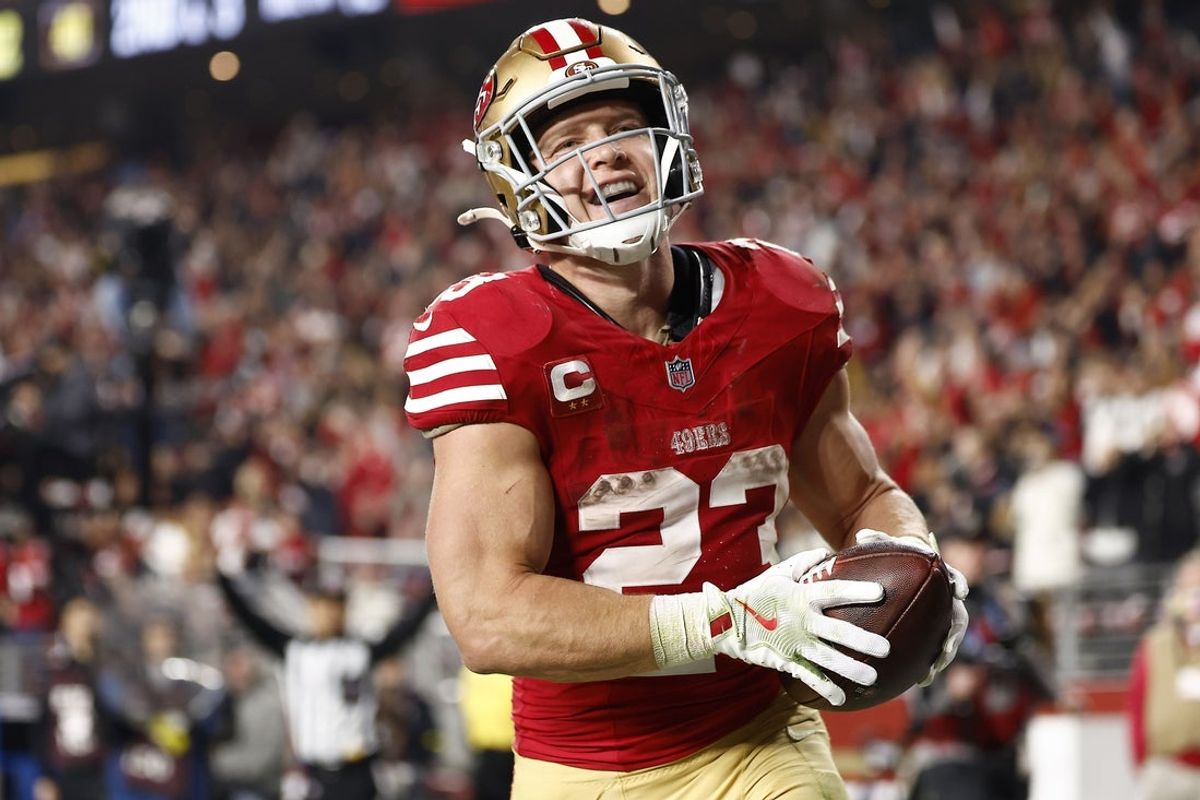 Nov 24, 2025; Santa Clara, California, USA; San Francisco 49ers running back Christian McCaffrey (23) reacts after scoring a touchdown against the Carolina Panthers during the second half at Levi's Stadium. Mandatory Credit: Kelley L Cox-Imagn Images