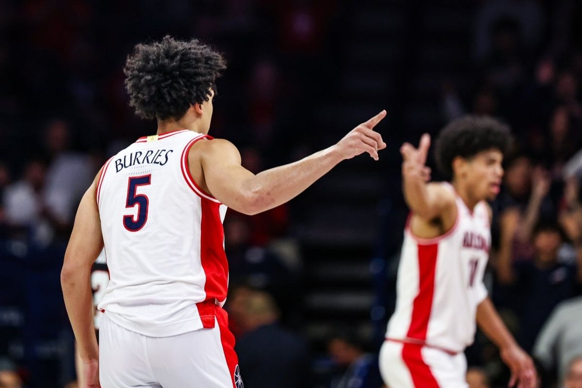 Nov 24, 2025; Tucson, Arizona, USA; Arizona Wildcats guard Brayden Burries (5) points after me makes a three pointer during the first half of the game against the Denver Pioneers at McKale Memorial Center. Mandatory Credit: Aryanna Frank-Imagn Images