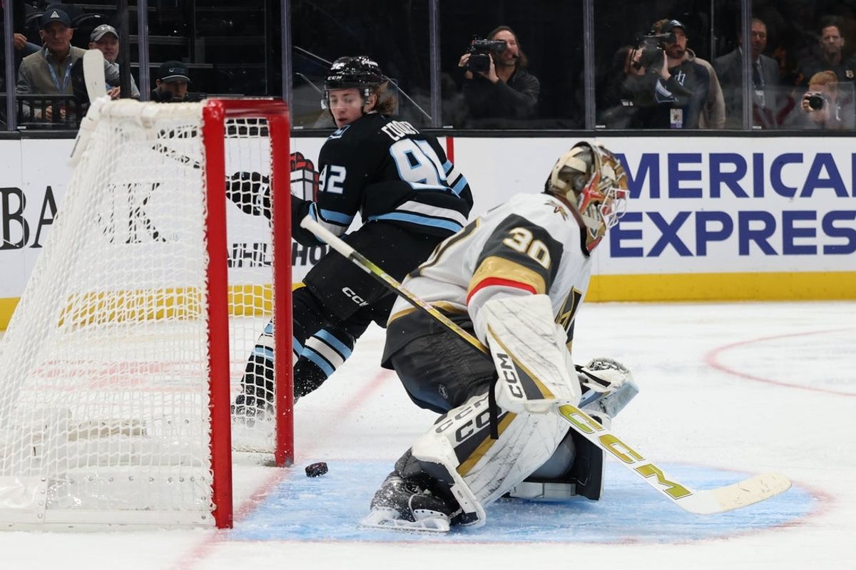 Nov 24, 2025; Salt Lake City, Utah, USA; Utah Mammoth center Logan Cooley (92) looks back to watch the puck go in the net past Vegas Golden Knights goaltender Carl Lindbom (30) during the third period at Delta Center. Mandatory Credit: Rob Gray-Imagn Images
