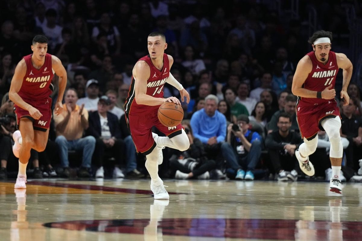 Nov 24, 2025; Miami, Florida, USA; Miami Heat guard Tyler Herro (14) brings the ball up the court against the Dallas Mavericks in the first half at Kaseya Center. Mandatory Credit: Jim Rassol-Imagn Images