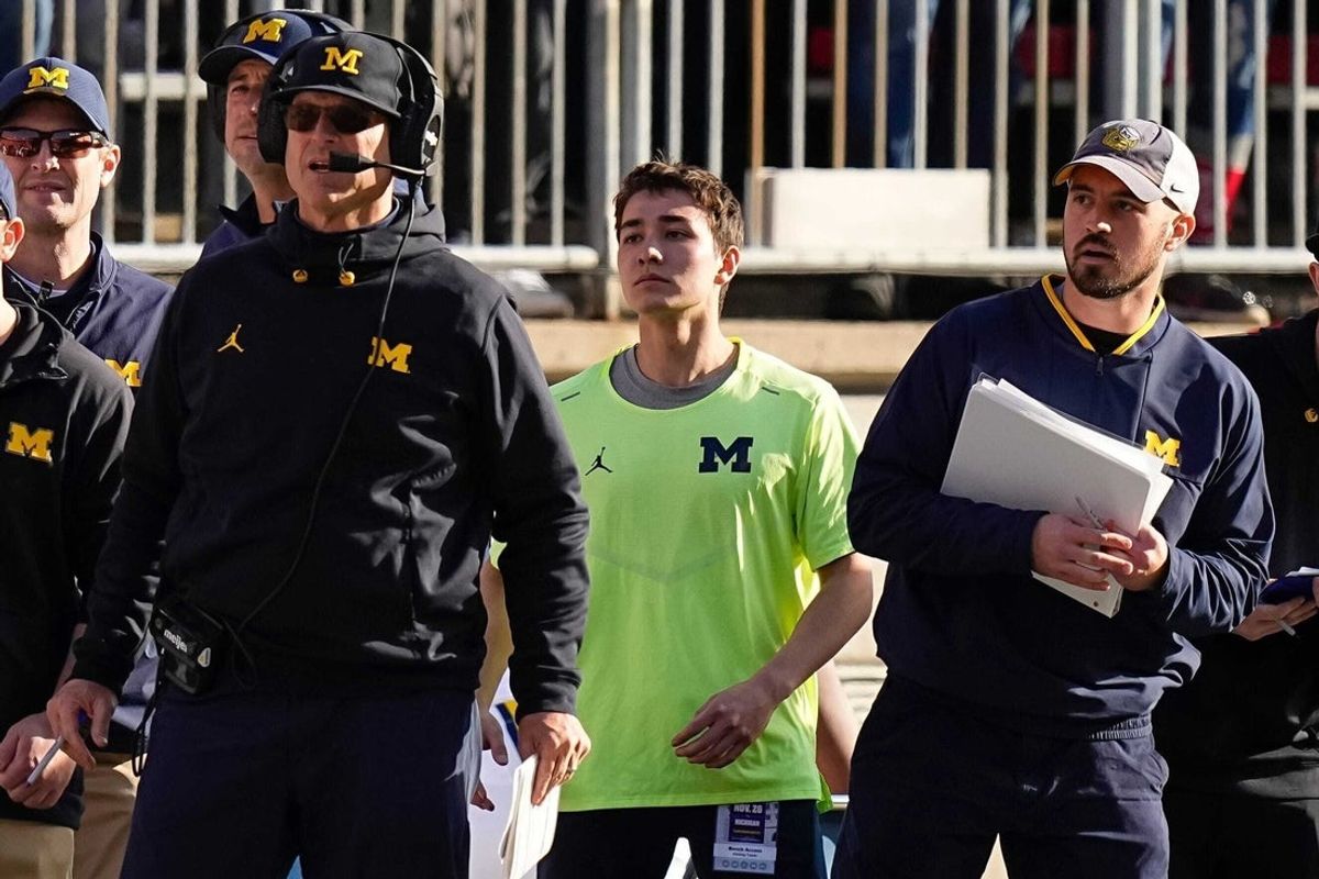 Michigan coach Jim Harbaugh watches from the sideline beside off-field analyst Connor Stalions during at Ohio State in 2022.