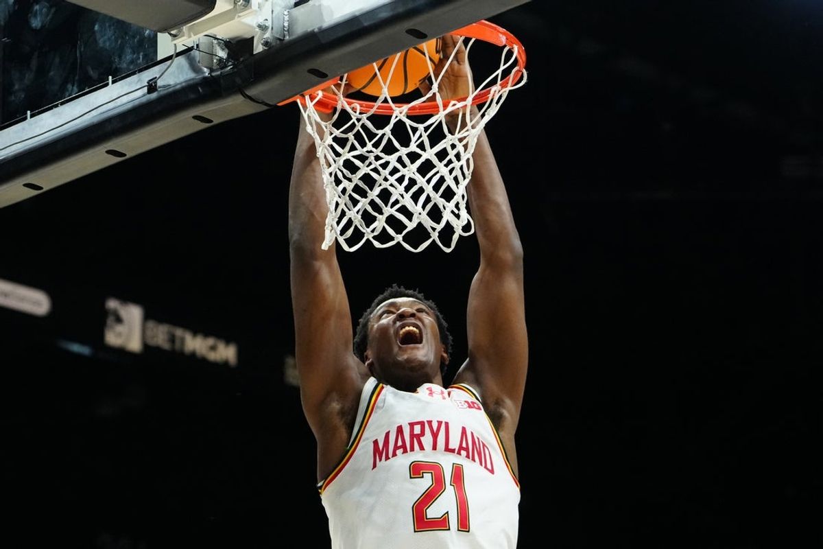 Nov 24, 2025; Las Vegas, Nevada, USA; Maryland Terrapins forward Pharrel Payne (21) shoots against UNLV Rebels forward Kimani Hamilton (2) during the first half in a 2025 Players Era Festival group play game at MGM Grand Garden Arena. Mandatory Credit: Stephen R. Sylvanie-Imagn Images