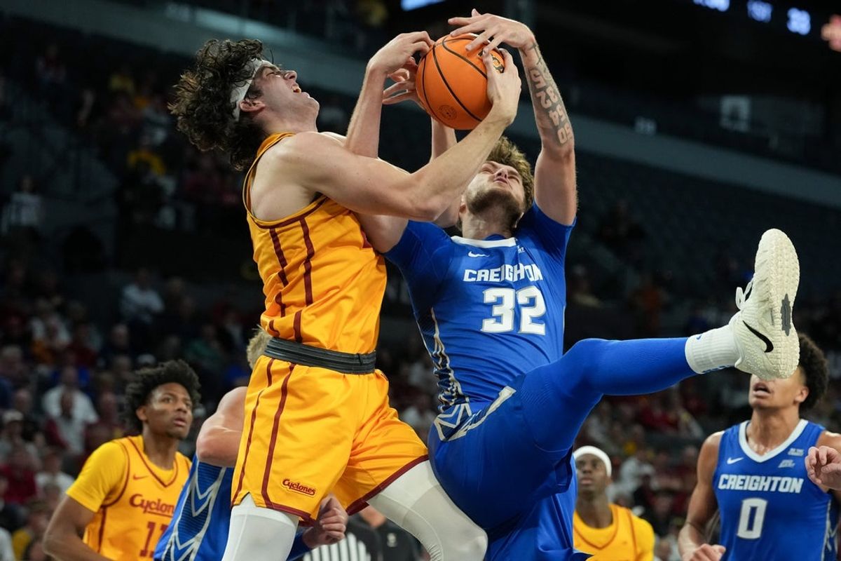 Nov 25, 2025; Las Vegas, Nevada, USA; Iowa State Cyclones forward Blake Buchanan (23) battles Creighton Bluejays forward Owen Freeman (32) for a rebound during the first half in a 2025 Players Era Festival group play game at Michelob Ultra Arena. Mandatory Credit: Kirby Lee-Imagn Images