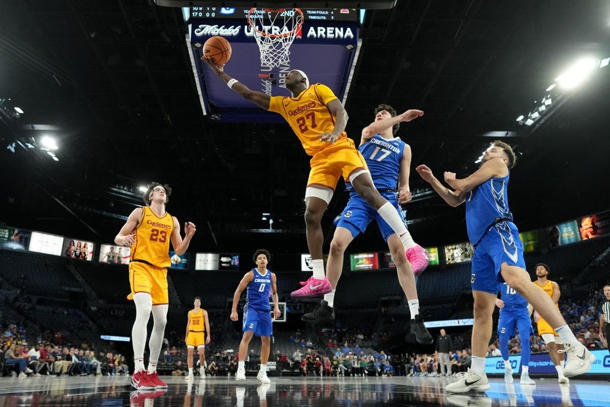 Nov 25, 2025; Las Vegas, Nevada, USA; Iowa State Cyclones guard Killyan Toure (27) shoots the ball defended by Creighton Bluejays forward Kerem Konan (17) during the second half in a 2025 Players Era Festival group play game at Michelob Ultra Arena. Mandatory Credit: Kirby Lee-Imagn Images