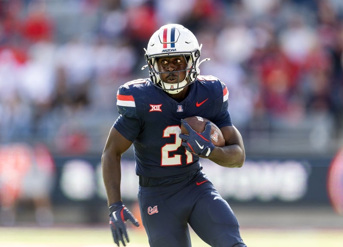 Nov 22, 2025; Tucson, Arizona, USA; Arizona Wildcats running back Ismail Mahdi (21) against the Baylor Bears at Casino Del Sol Stadium. Mandatory Credit: Mark J. Rebilas-Imagn Images