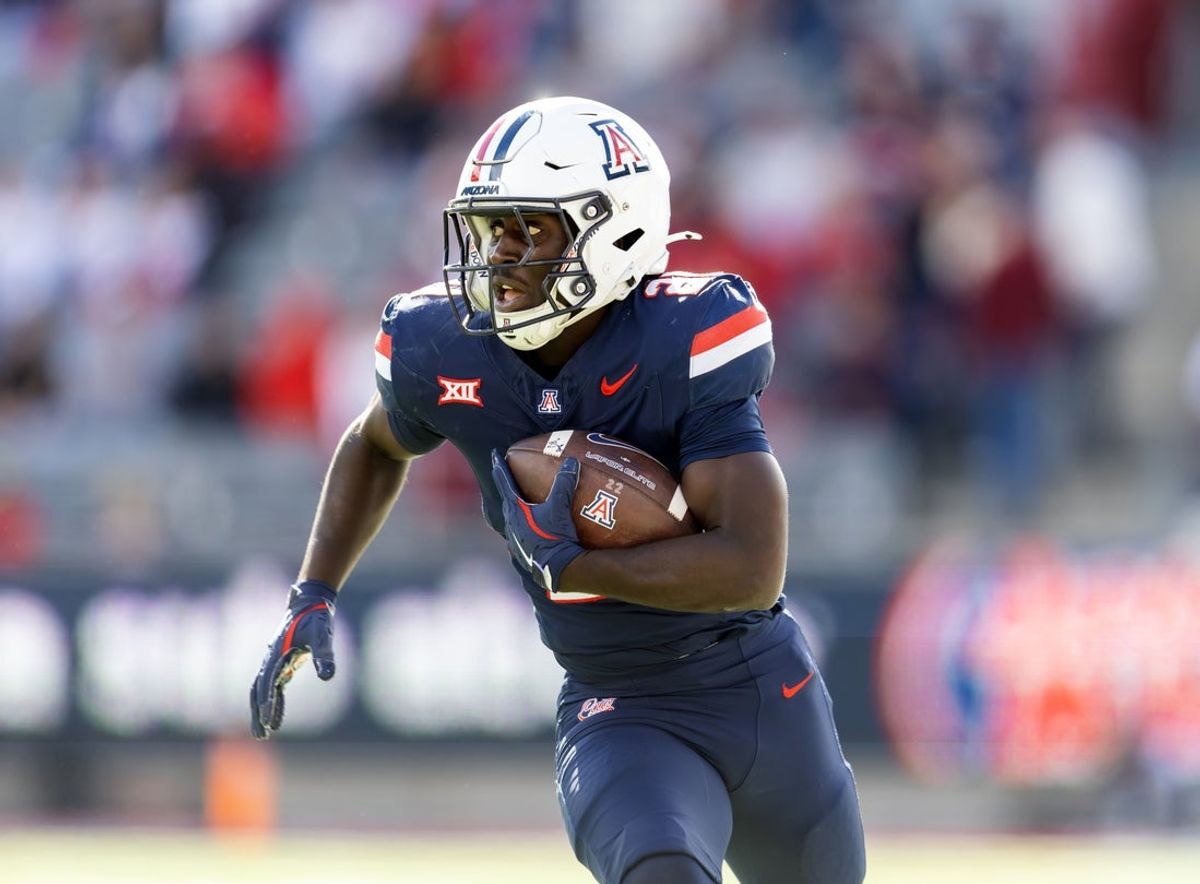 Nov 22, 2025; Tucson, Arizona, USA; Arizona Wildcats running back Ismail Mahdi (21) against the Baylor Bears at Casino Del Sol Stadium. Mandatory Credit: Mark J. Rebilas-Imagn Images