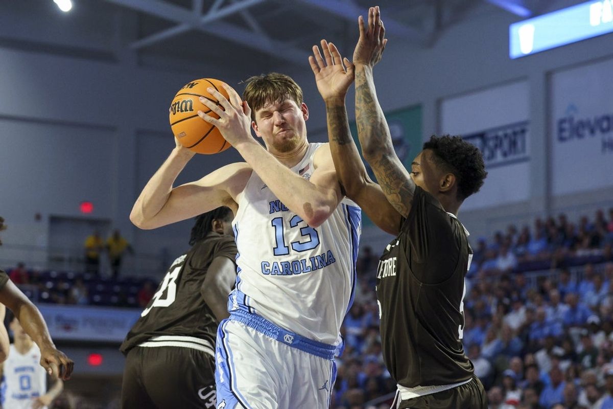 Nov 25, 2025; Fort Myers, Florida, USA; North Carolina Tar Heels center Henri Veesaar (13) is guarded by St. Bonaventure Bonnies guard Dasonte Bowen (5) in the first half at Suncoast Credit Union Arena. Mandatory Credit: Nathan Ray Seebeck-Imagn Images