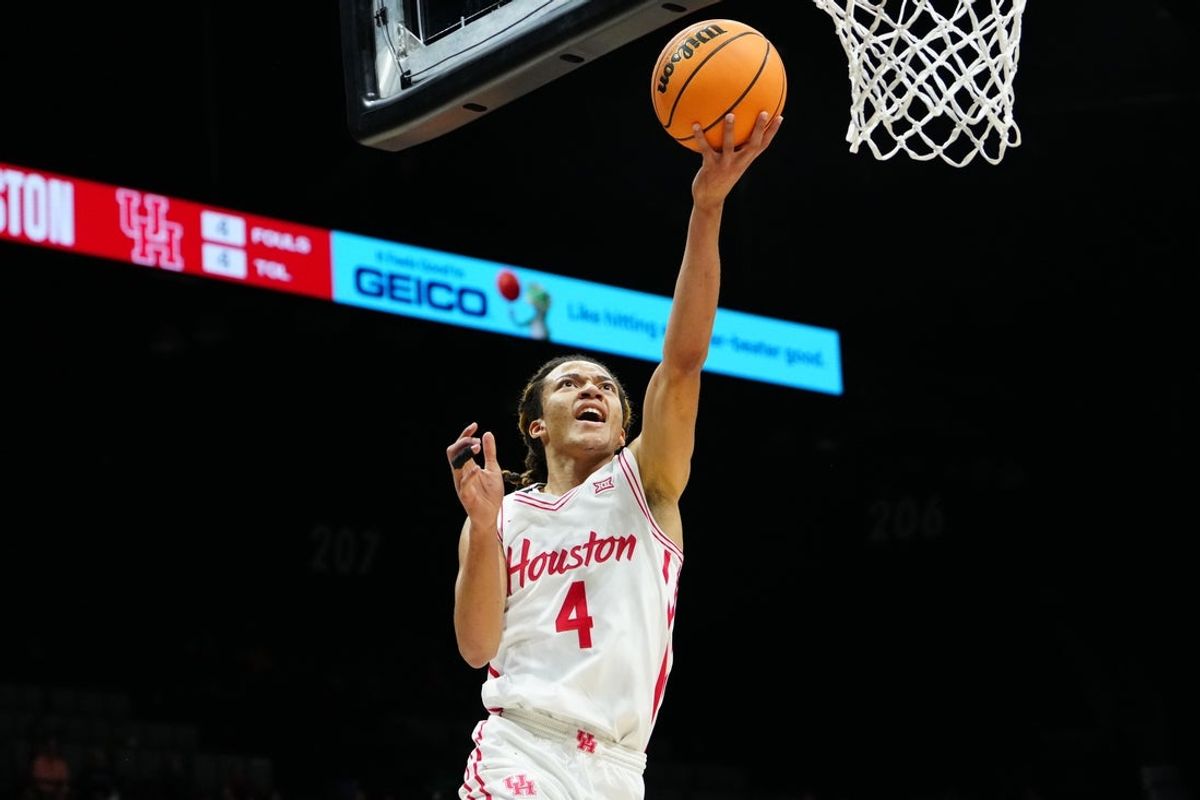 Nov 25, 2025; Las Vegas, NV, USA; Houston Cougars guard Kingston Flemings (4) goes for a layup in a 2025 Players Era Festival group play game against the Tennessee Volunteers during the first half at MGM Grand Garden Arena. Mandatory Credit: Stephen R. Sylvanie-Imagn Images