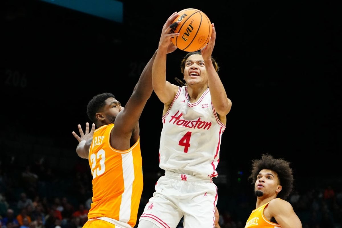 Nov 25, 2025; Las Vegas, NV, USA; Houston Cougars guard Kingston Flemings (4) drives to the basket against Tennessee Volunteers forward Jaylen Carey (23) in a 2025 Players Era Festival group play game during the first half at MGM Grand Garden Arena. Mandatory Credit: Stephen R. Sylvanie-Imagn Images