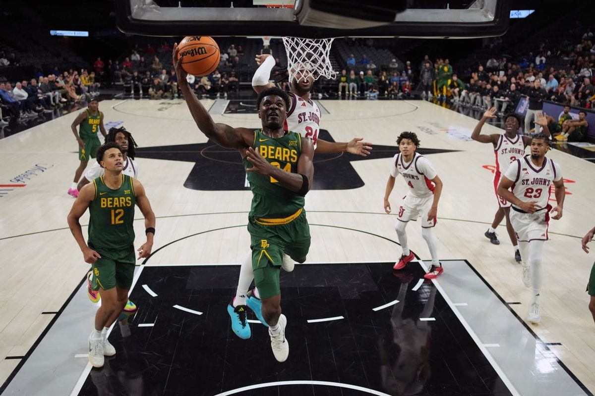 Nov 25, 2025; Las Vegas, Nevada, USA; Baylor Bears guard Tounde Yessoufou (24) shoots the ball against St. John's Red Storm forward Zuby Ejiofor (24) in a 2025 Players Era Festival group play game at Michelob Ultra Arena. Mandatory Credit: Kirby Lee-Imagn Images
